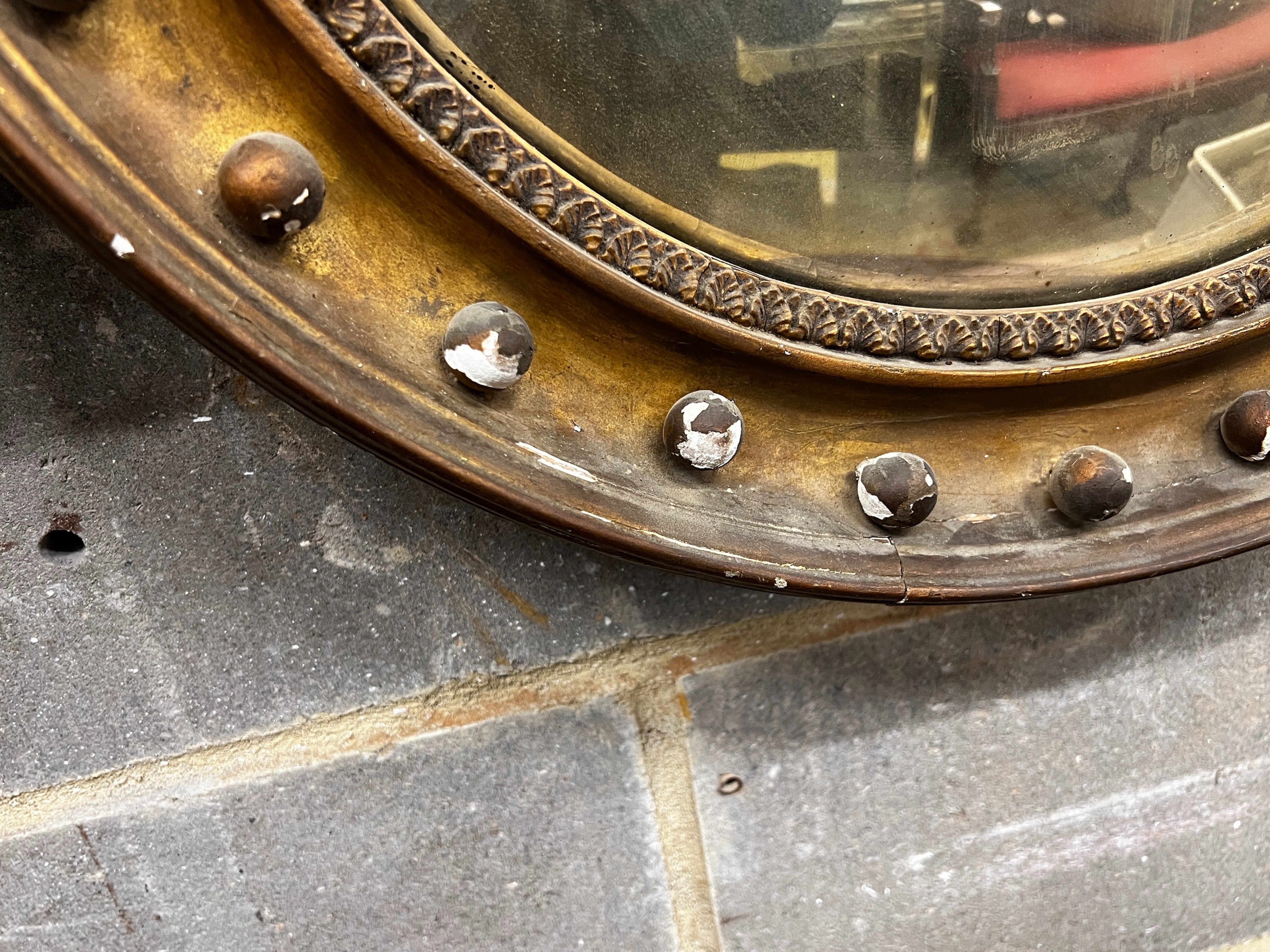 A Regency giltwood convex wall mirror in need of repair, diameter 56cm